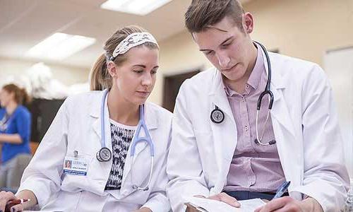 Doctor and student with clip board